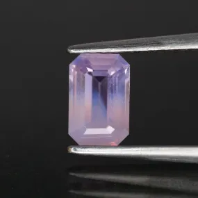 Sapphire opalescent | natural purplish pink, emerald cut 6.6x4.3mm, VS *0.9ct